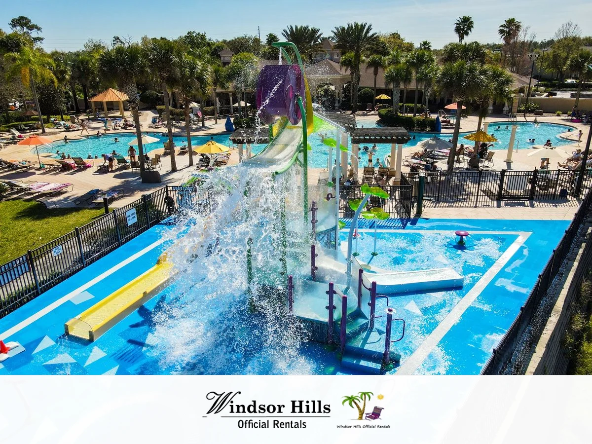 Windsor Hills resort pool at twilight with official community logo