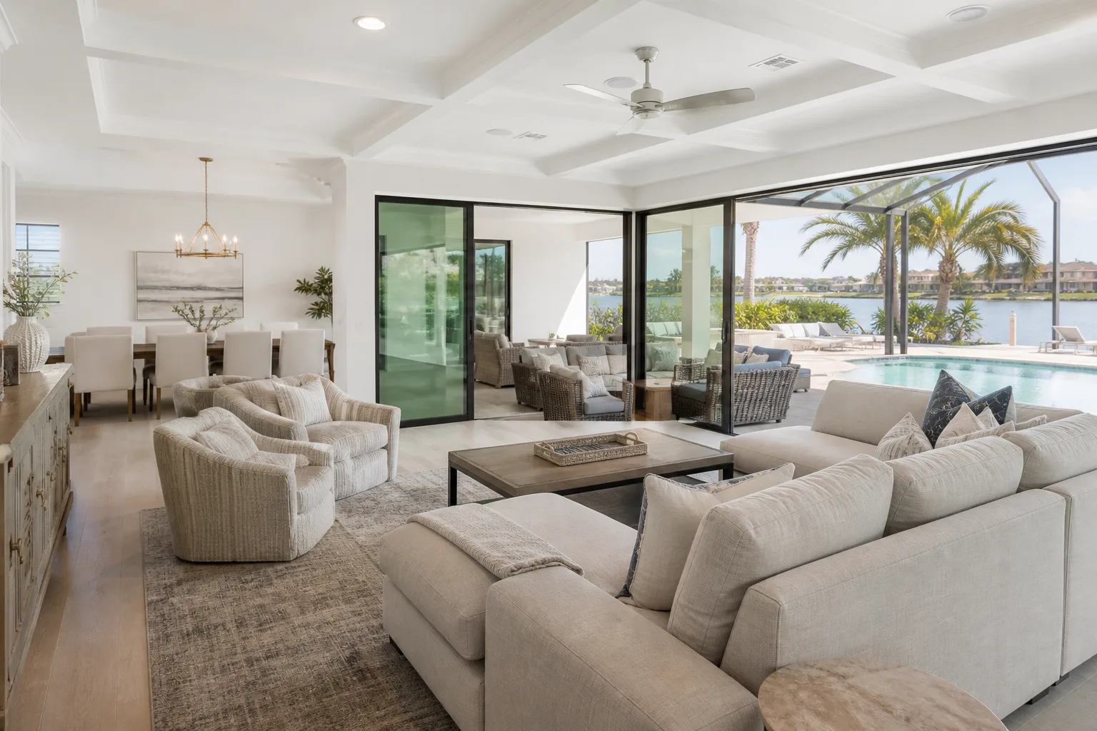 Open-concept living room and pool lanai furnished for a Tampa, Florida vacation rental