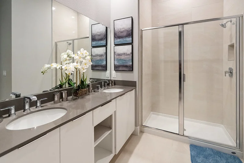 Primary spa bathroom with freestanding tub, double vanity, and upgraded vacation rental finishes