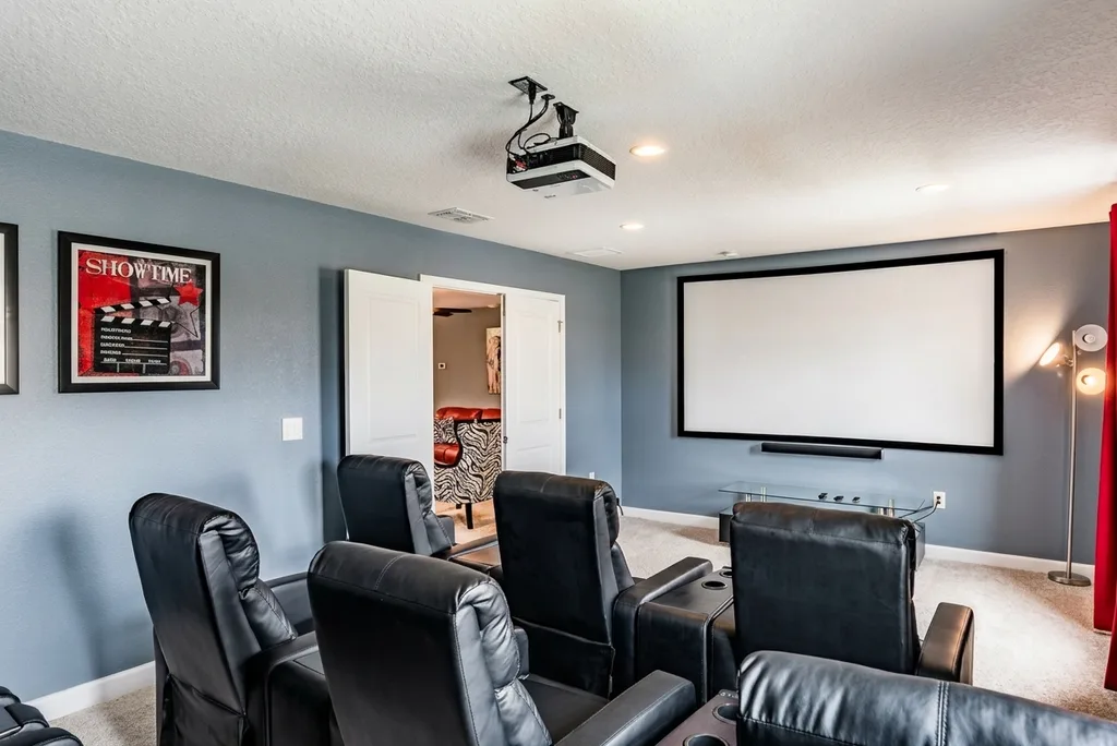 Theater room furnished by Furniture Packages USA at 9162 Scramble Drive